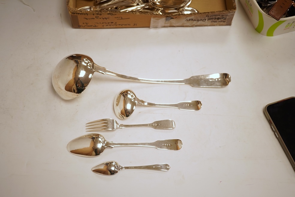 A 19th century matched part canteen of 19th century silver fiddle pattern flatware including a soup ladle and a sauce ladle, twelve table spoons, eight table forks, eight dessert forks, eight dessert spoons and six teasp